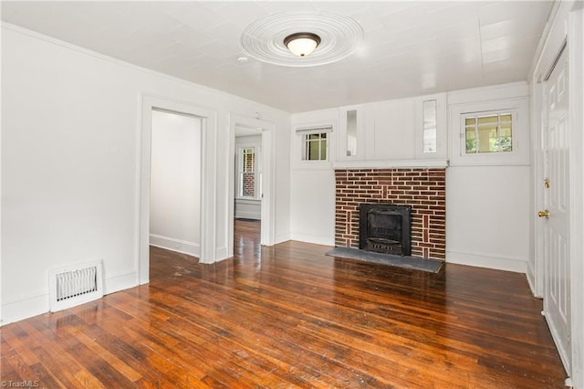 unfurnished living room featuring wood-type flooring and a fireplace