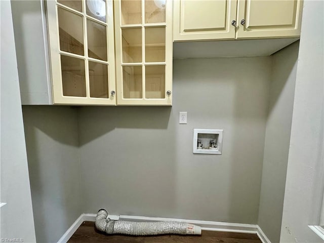 clothes washing area with hookup for an electric dryer, hookup for a washing machine, and cabinets