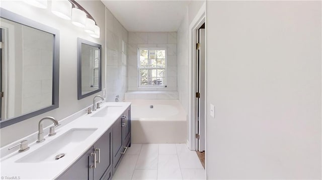 full bath featuring a garden tub and double vanity