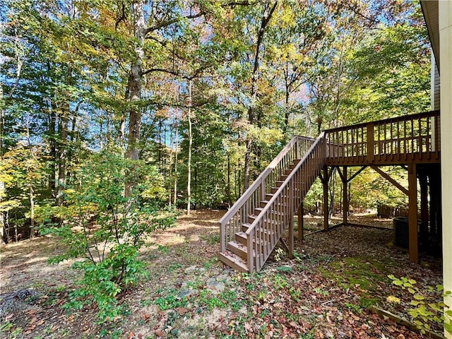 view of yard with stairway and a deck