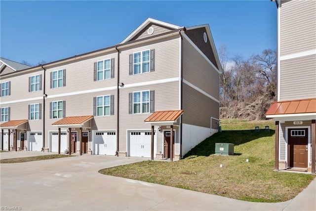 view of front of property with a front lawn and a garage