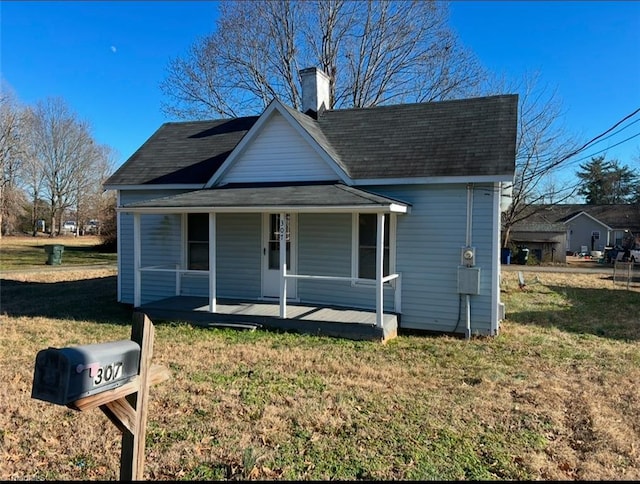 bungalow featuring a porch and a front yard