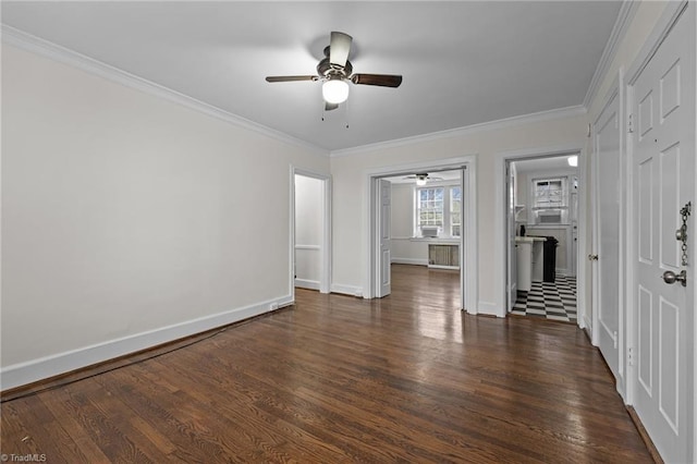 unfurnished bedroom featuring ensuite bathroom, a ceiling fan, baseboards, ornamental molding, and dark wood-style floors