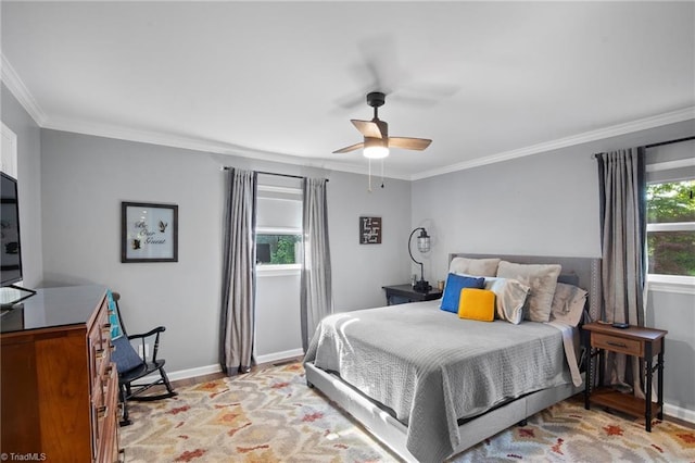 bedroom with baseboards, ornamental molding, light wood-type flooring, and a ceiling fan