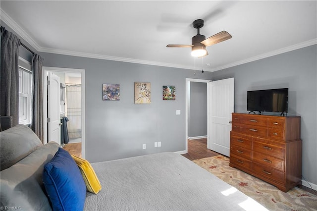 bedroom featuring baseboards, ceiling fan, light wood finished floors, and crown molding