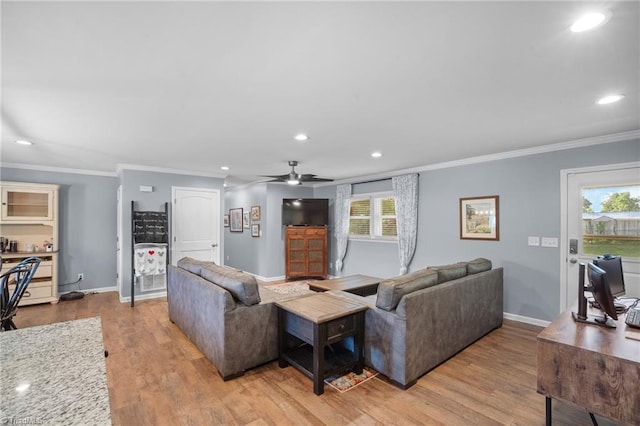 living room with baseboards, recessed lighting, and crown molding