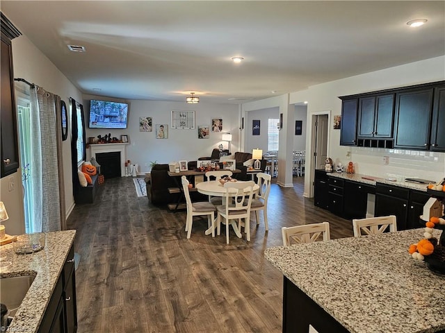 dining area featuring dark hardwood / wood-style flooring