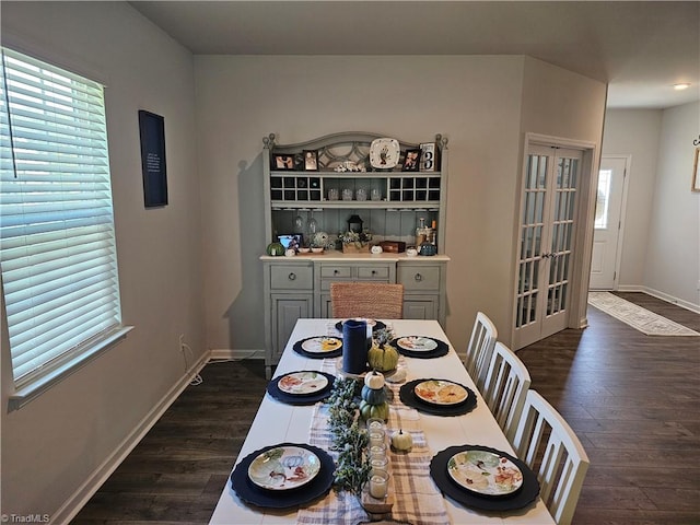 dining space featuring dark hardwood / wood-style floors