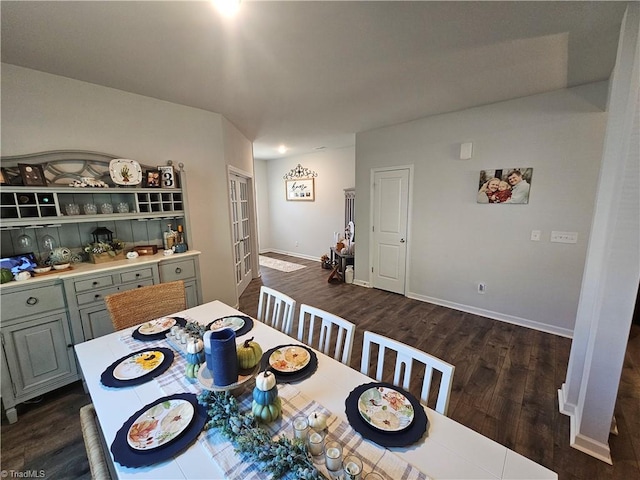 dining area with dark wood-type flooring