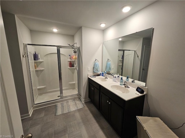 bathroom with walk in shower and vanity