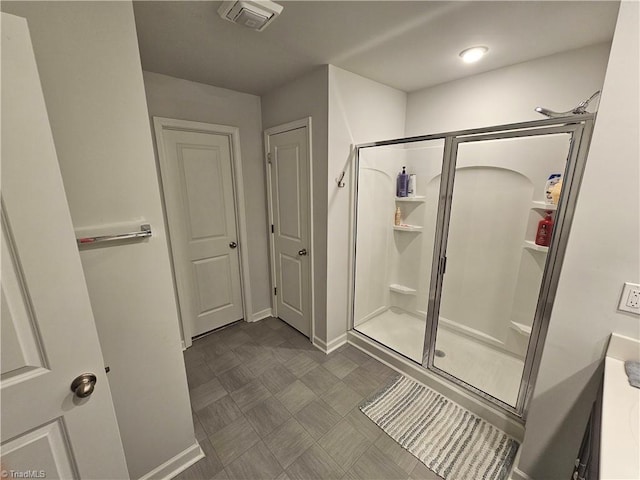 bathroom with vanity and an enclosed shower