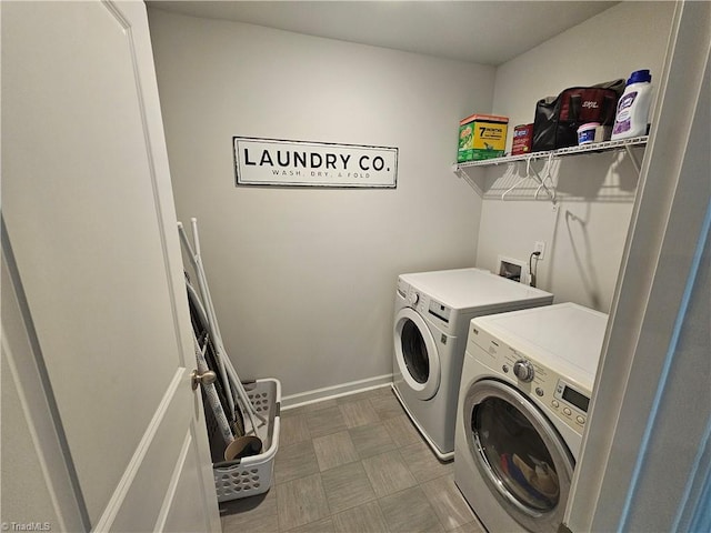 clothes washing area featuring washer and dryer