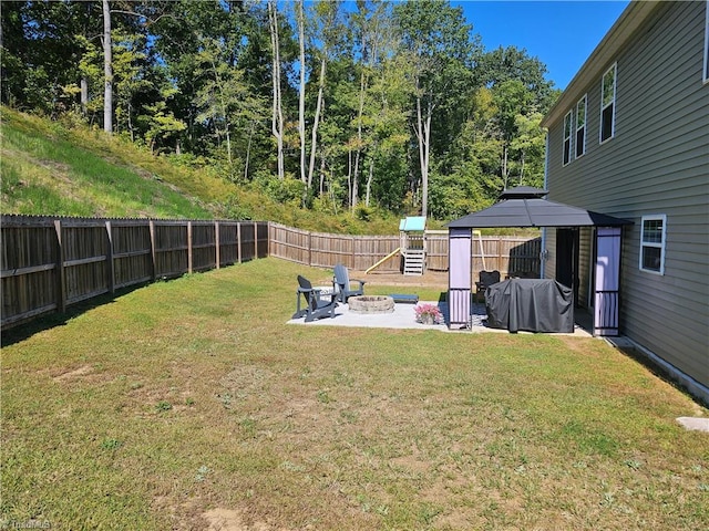 view of yard featuring a gazebo, an outdoor fire pit, and a patio area