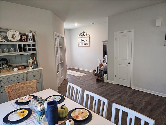 dining area featuring dark hardwood / wood-style flooring