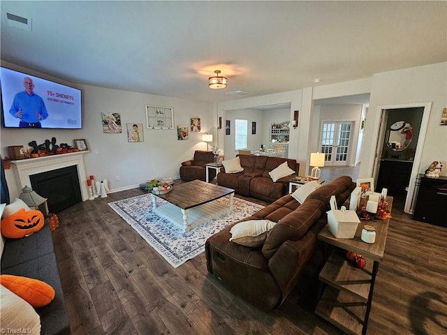 living room with dark hardwood / wood-style floors