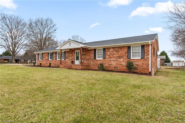 ranch-style home with a shingled roof, a front yard, brick siding, and crawl space