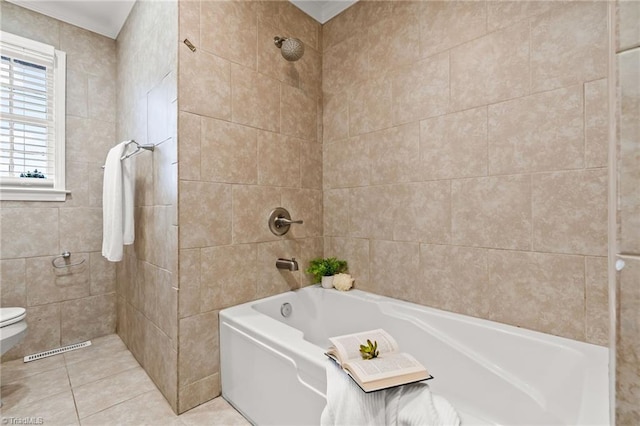 bathroom featuring tile patterned flooring, tile walls, toilet, and visible vents