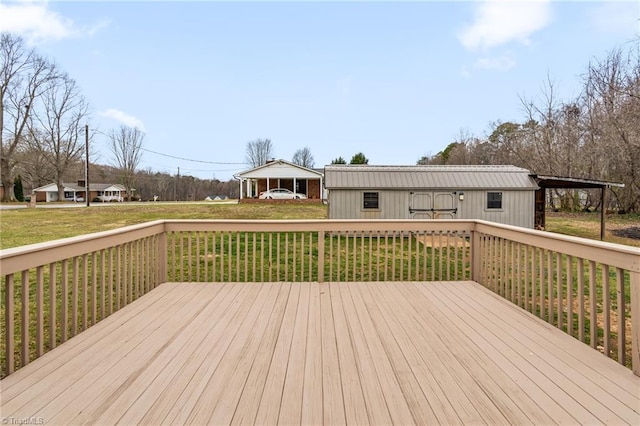 wooden deck featuring a yard