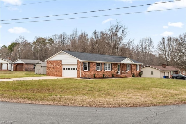 ranch-style home featuring a front yard, an attached garage, brick siding, and driveway