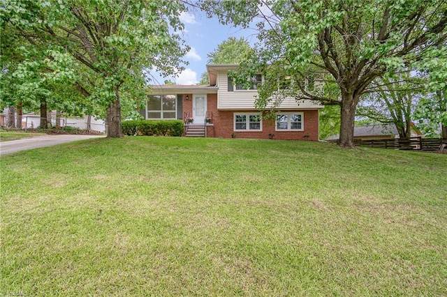2102 Castlerock Rd, Greensboro, NC 27406 - tri-level home with brick siding and driveway