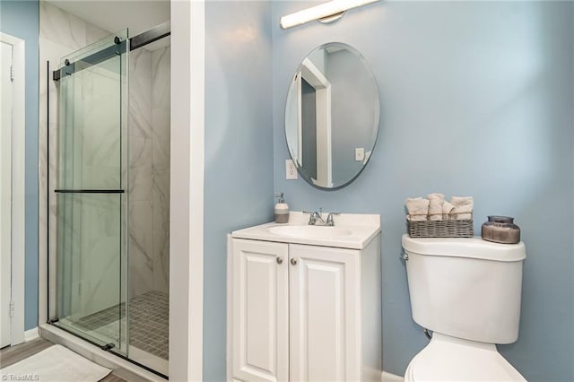 2102 Castlerock Rd, Greensboro, NC 27406 - bathroom featuring a shower stall, toilet, and vanity