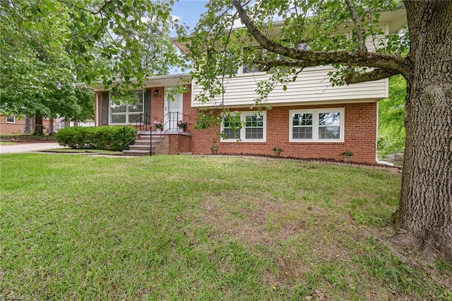 2102 Castlerock Rd, Greensboro, NC 27406 - split level home featuring brick siding and a front yard