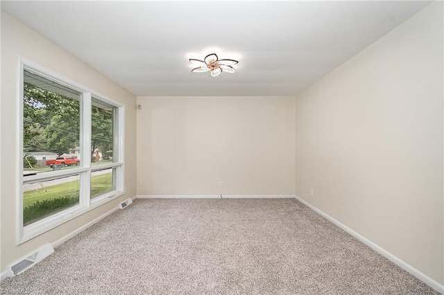 2102 Castlerock Rd, Greensboro, NC 27406 - carpeted empty room featuring baseboards