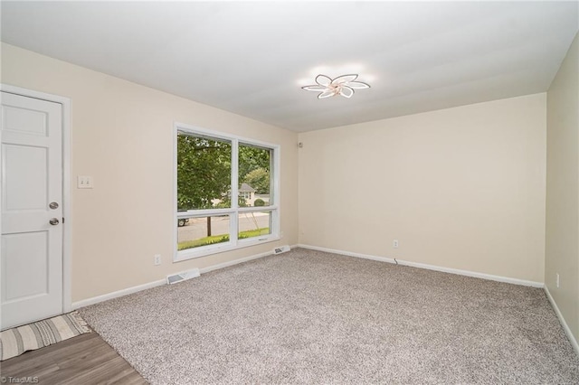 2102 Castlerock Rd, Greensboro, NC 27406 - unfurnished room featuring baseboards and carpet floors