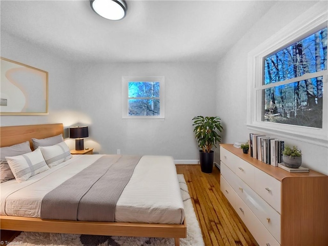 bedroom with light wood-type flooring