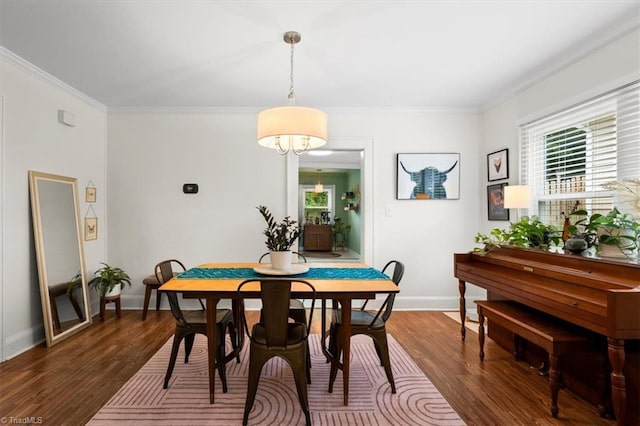 209 Burtner St, Greensboro, NC 27406 - dining area with healthy amount of natural light, wood finished floors, crown molding, and baseboards