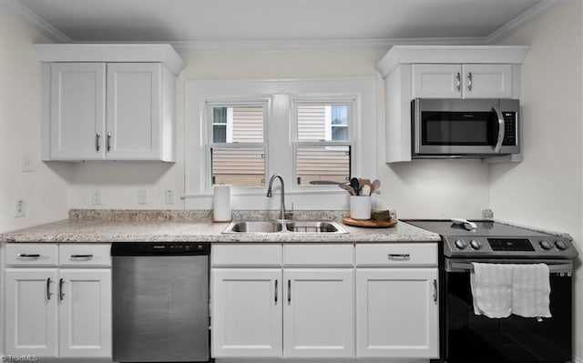 209 Burtner St, Greensboro, NC 27406 - kitchen featuring stainless steel appliances, a sink, white cabinetry, and ornamental molding