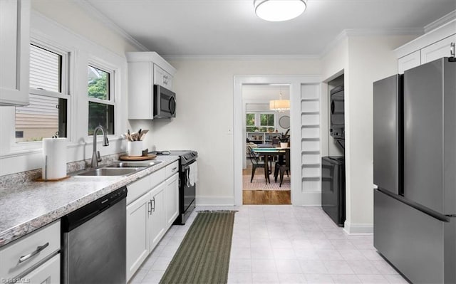 209 Burtner St, Greensboro, NC 27406 - kitchen with appliances with stainless steel finishes, a sink, crown molding, white cabinetry, and light countertops