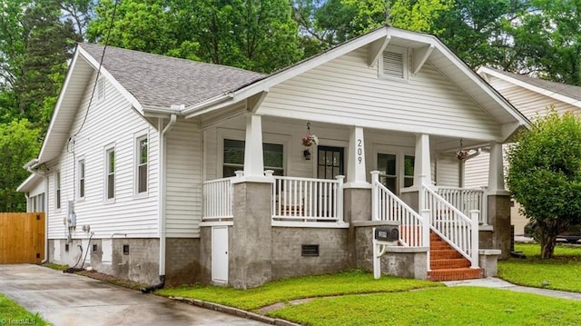 209 Burtner St, Greensboro, NC 27406 - bungalow-style house with a porch and a shingled roof
