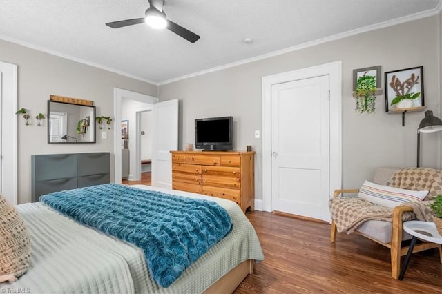 209 Burtner St, Greensboro, NC 27406 - bedroom featuring wood finished floors, crown molding, a textured ceiling, and a ceiling fan