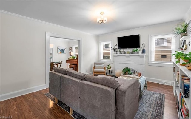209 Burtner St, Greensboro, NC 27406 - living area featuring dark wood-style floors, ornamental molding, and baseboards
