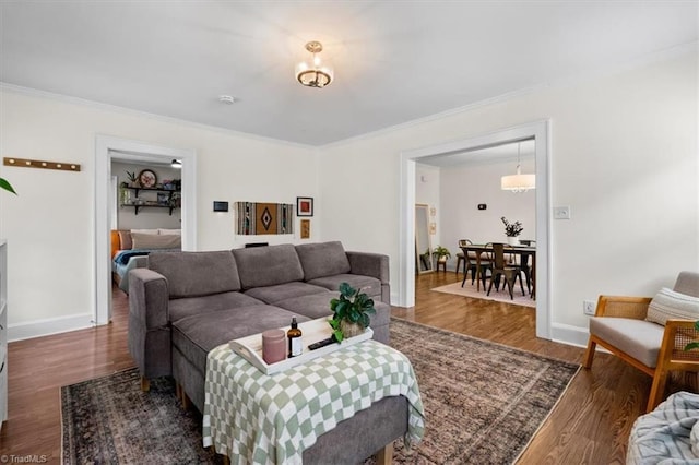 209 Burtner St, Greensboro, NC 27406 - living room featuring wood finished floors, ornamental molding, and baseboards