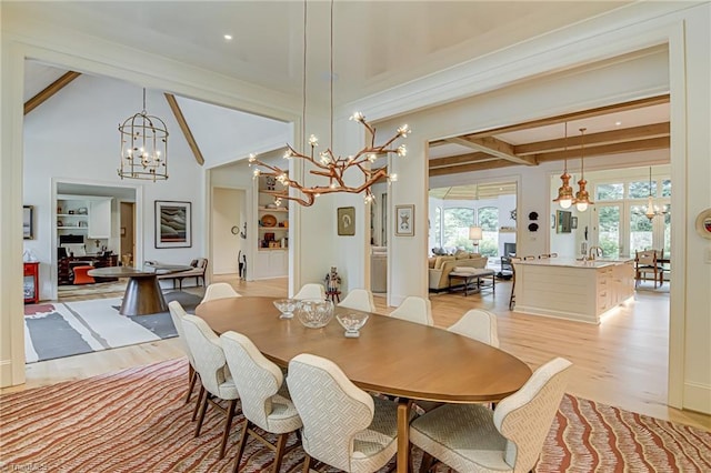 2632 Bartram Pl, Winston-Salem, NC 27106 - dining area with a chandelier, beamed ceiling, and light wood finished floors