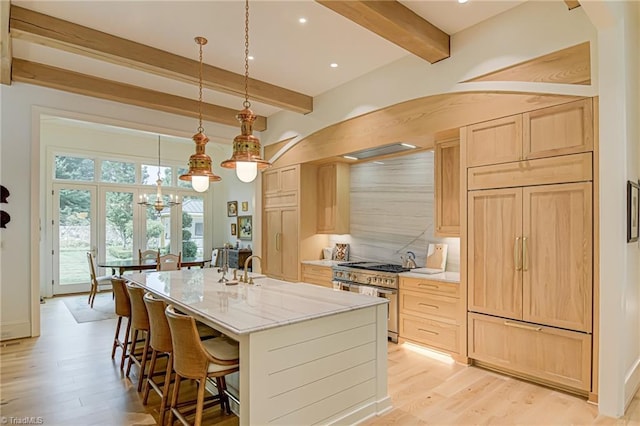 2632 Bartram Pl, Winston-Salem, NC 27106 - kitchen featuring high end appliances, light brown cabinets, beamed ceiling, light wood-style floors, and a chandelier