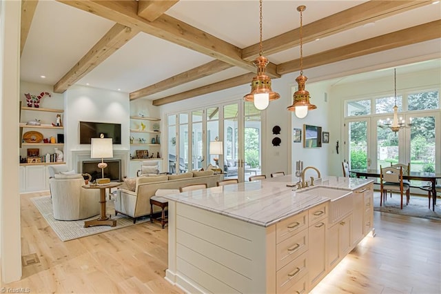 2632 Bartram Pl, Winston-Salem, NC 27106 - kitchen featuring light wood-style floors, beamed ceiling, plenty of natural light, and a chandelier