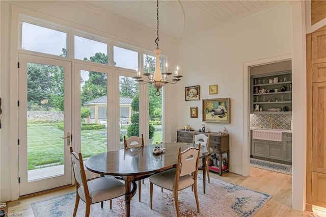 2632 Bartram Pl, Winston-Salem, NC 27106 - dining area featuring a chandelier, light wood-style floors, and lofted ceiling