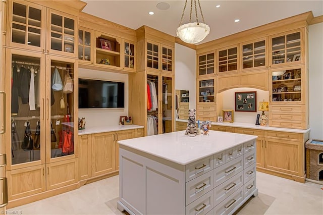 2632 Bartram Pl, Winston-Salem, NC 27106 - kitchen with light countertops, glass insert cabinets, recessed lighting, hanging light fixtures, and a kitchen island