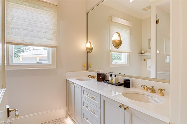 2632 Bartram Pl, Winston-Salem, NC 27106 - full bathroom with healthy amount of natural light, double vanity, and tile patterned floors