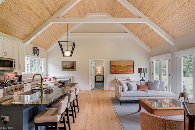 2632 Bartram Pl, Winston-Salem, NC 27106 - living area featuring a wood ceiling with exposed beams, light wood-style flooring, and high vaulted ceiling