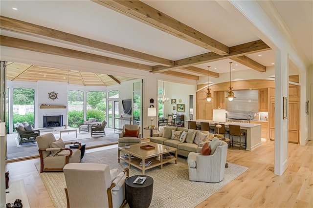 2632 Bartram Pl, Winston-Salem, NC 27106 - living area with beam ceiling, a fireplace with raised hearth, and light wood-style floors