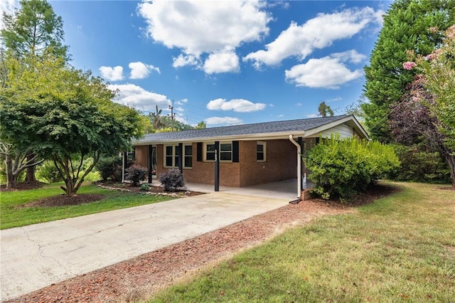 single story home with a front yard and a carport