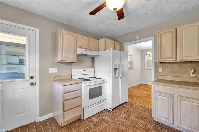 kitchen with white appliances, dark hardwood / wood-style flooring, a textured ceiling, light brown cabinetry, and ceiling fan