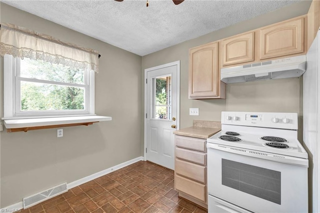 kitchen with ceiling fan, a textured ceiling, light brown cabinetry, and white range with electric stovetop