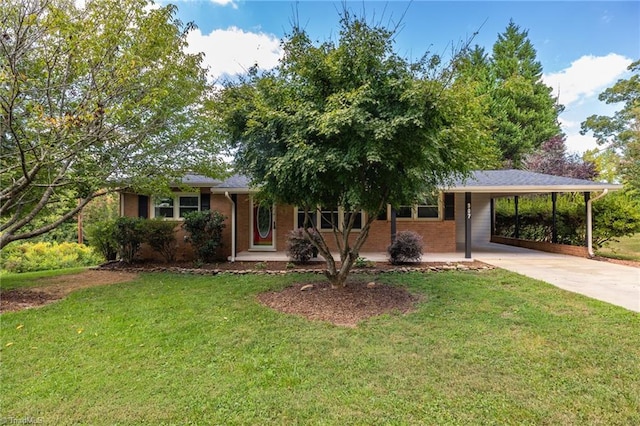 view of front of property with a front yard and a carport