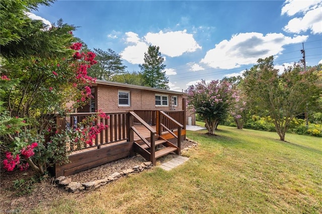 back of house with a deck and a lawn