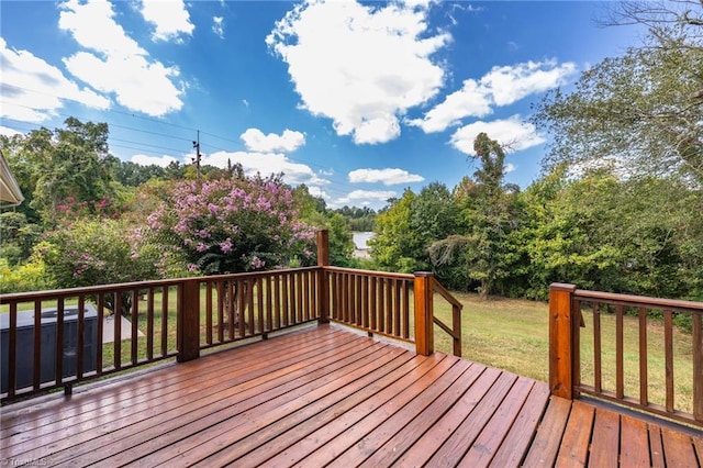 wooden terrace with a lawn